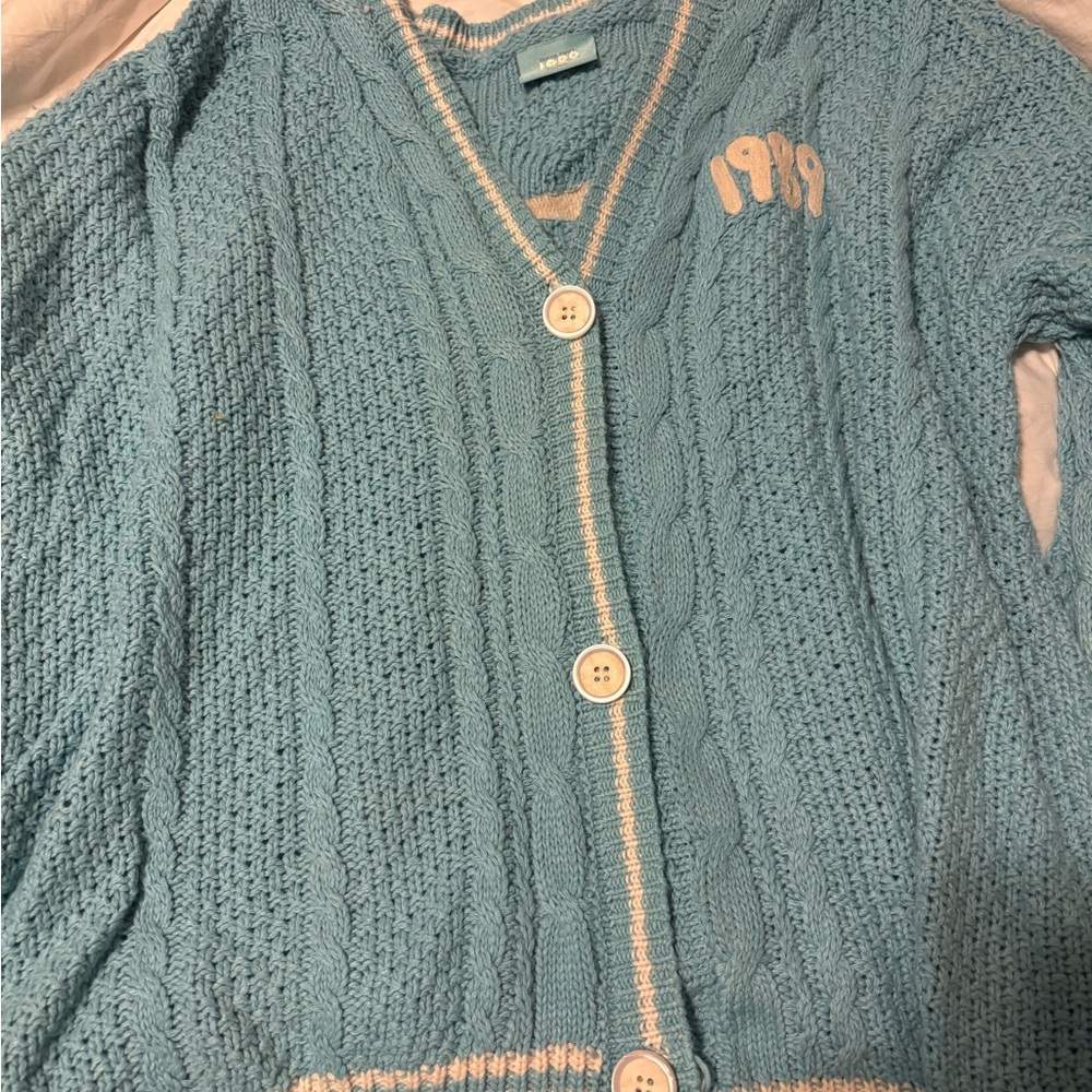Taylor Swift 1989 cardigan. Never worn, but came with a few loose threads.